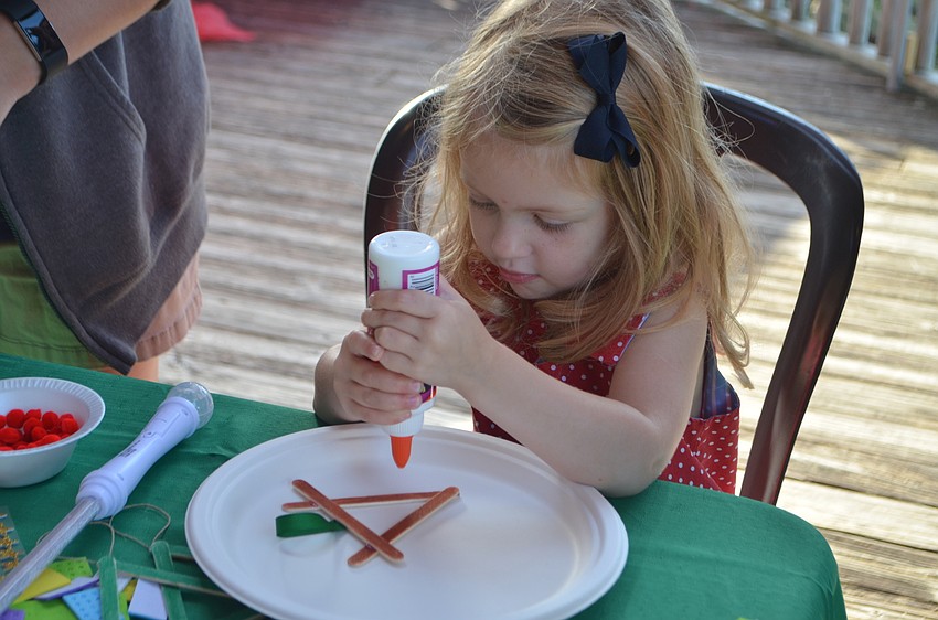 Olivia Rowley, 3, makes a reindeer craft during breakfast with Santa at The Old Salty Dog on Dec. 17.