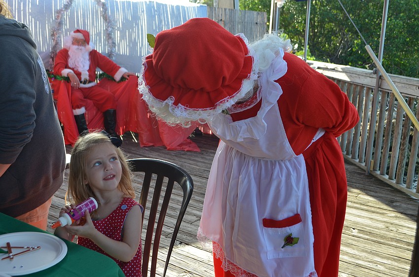 Mrs. Claus talks with Olivia Rowley, 3. Santa and Mrs. Claus took a break from the North Pole to visit The Old Salty Dog on Dec. 17.