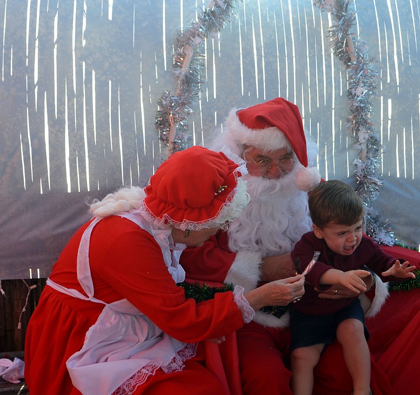 Liam Herrera, 1, couldn’t be bribed with a candy cane to sit on Santa’s lap.