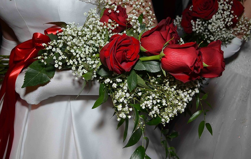 Each debutante carried a bouquet of roses during their formal introduction at the 2016 Debutante Ball on Dec. 17.