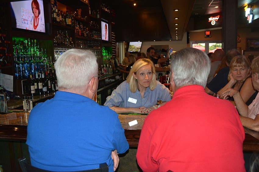 Cheers for Charity member Annie Breitinger takes another order during the fundraiser.