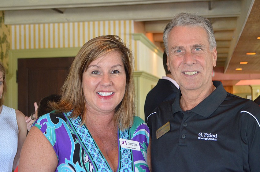 Kerry Conboy of Big Brothers and Big Sisters of the Sun Coast and Joel Trippiedi of G. Fried Flooring America