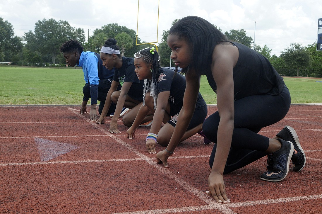 The Out-of-Door Academy eighth-grader Saraiah Walkes, front, will lead the Academy of Maximum Performance track club, including Keymani Dillingham, Aliyah Cunningham and Priscilla Miller, into the 2016 AAU Junior Olympics July 30 through Aug. 6, in Housto
