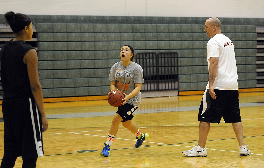 Haile Middle School seventh-grader Kaylee Kehler dribbles to the basket during the Nike Girls Basketball Camp July 6, at Lakewood Ranch High.