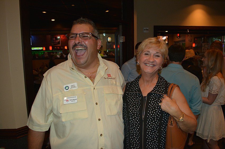 The Ranch Grill owner Darrin Simone shares a laugh with Commissioner Vanessa Baugh.