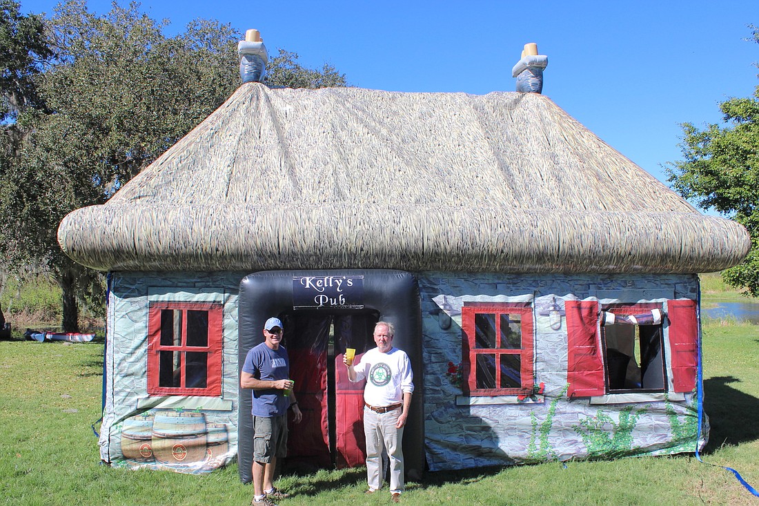 Former NFL star Steve Christie and Irish Celtic Festival Director Frank Shea stand in front of Kelly Christie&#39;   s Pop Up Pub.