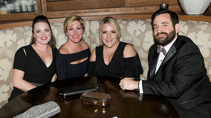 Courtney Church and sister Stephanie Church with Erin and Doug Christy