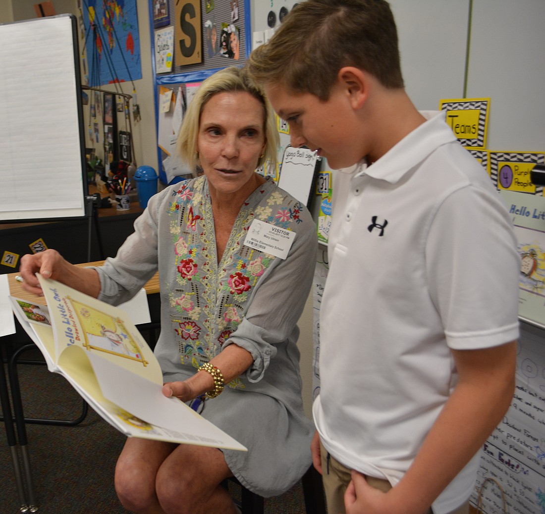 Mary Uihlein chats with Willis student Brandon Spofford about one of her "Hello Little Owl" books.