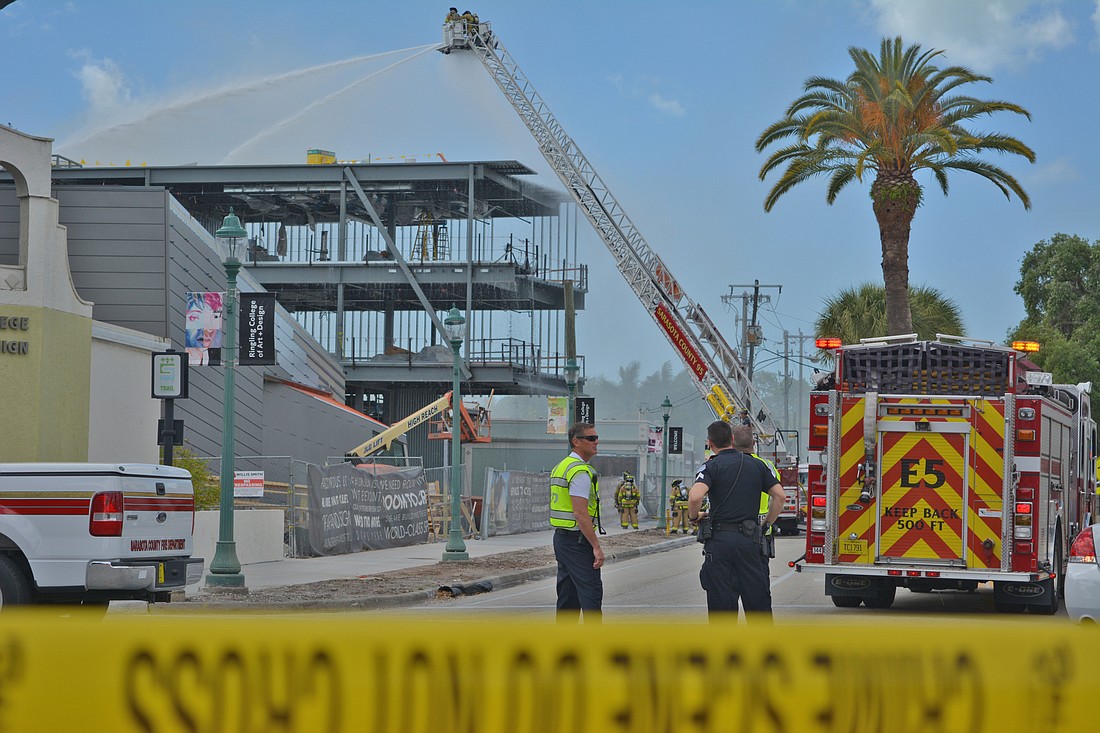 Sarasota County Fire Department and Sarasota Police Department personnel work to fight a 3-alarm fire at the Ringling College of Art and Design Richard and Barbara Basch Visual Arts Center.