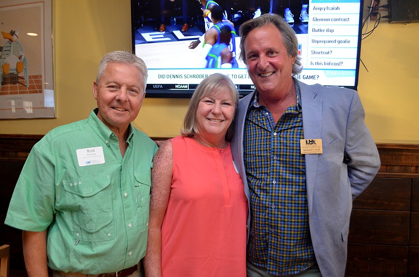 Bob and Carol Erker and Mike Doll