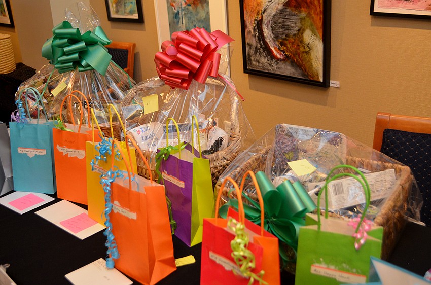 Raffle items lined the foyer of Bird Key Yacht Club so that as attendees arrived they could look at the various baskets.