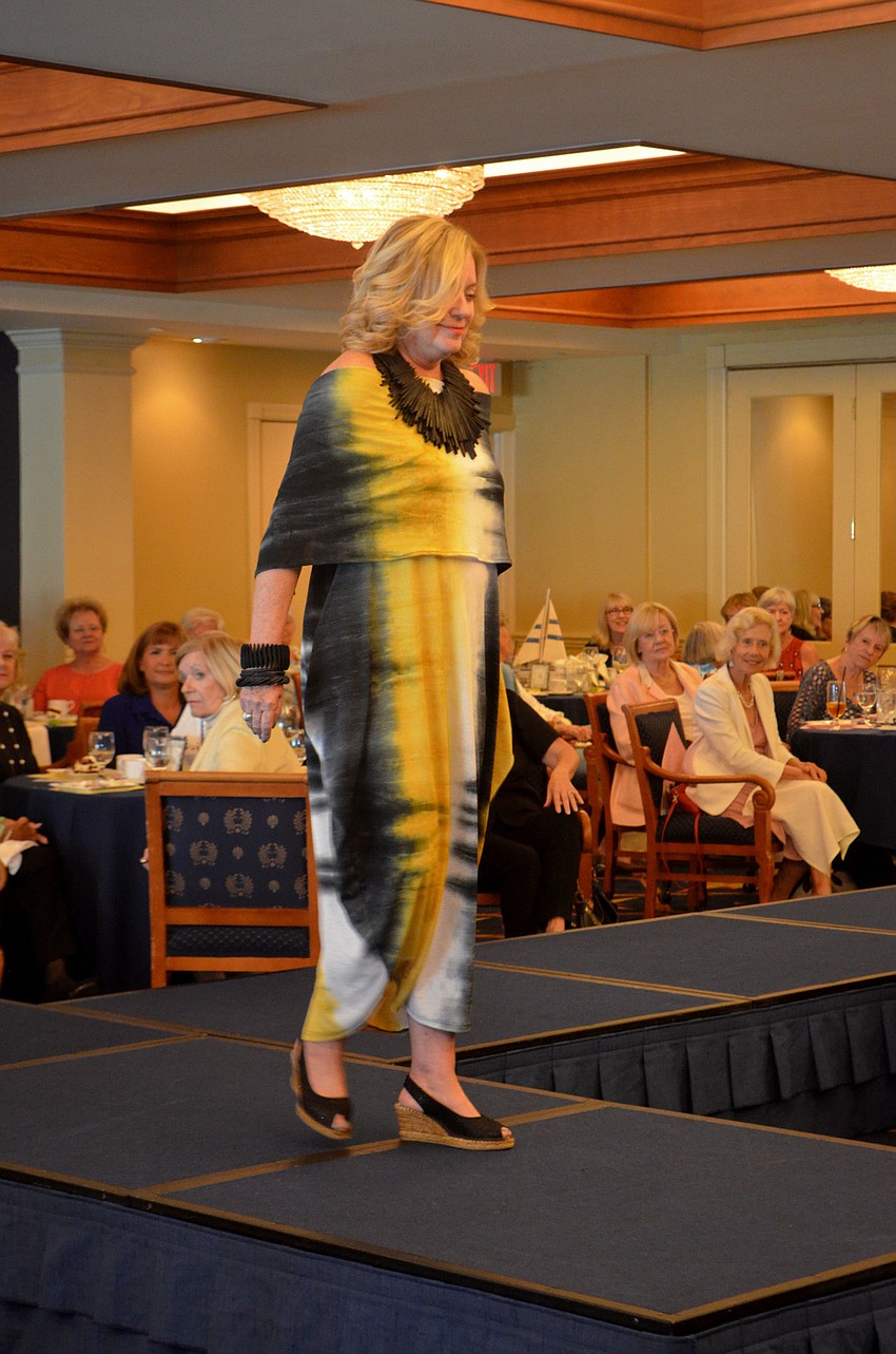 Laurel Phillips works the runway in a black and gold piece from Dream Weaver Collection.