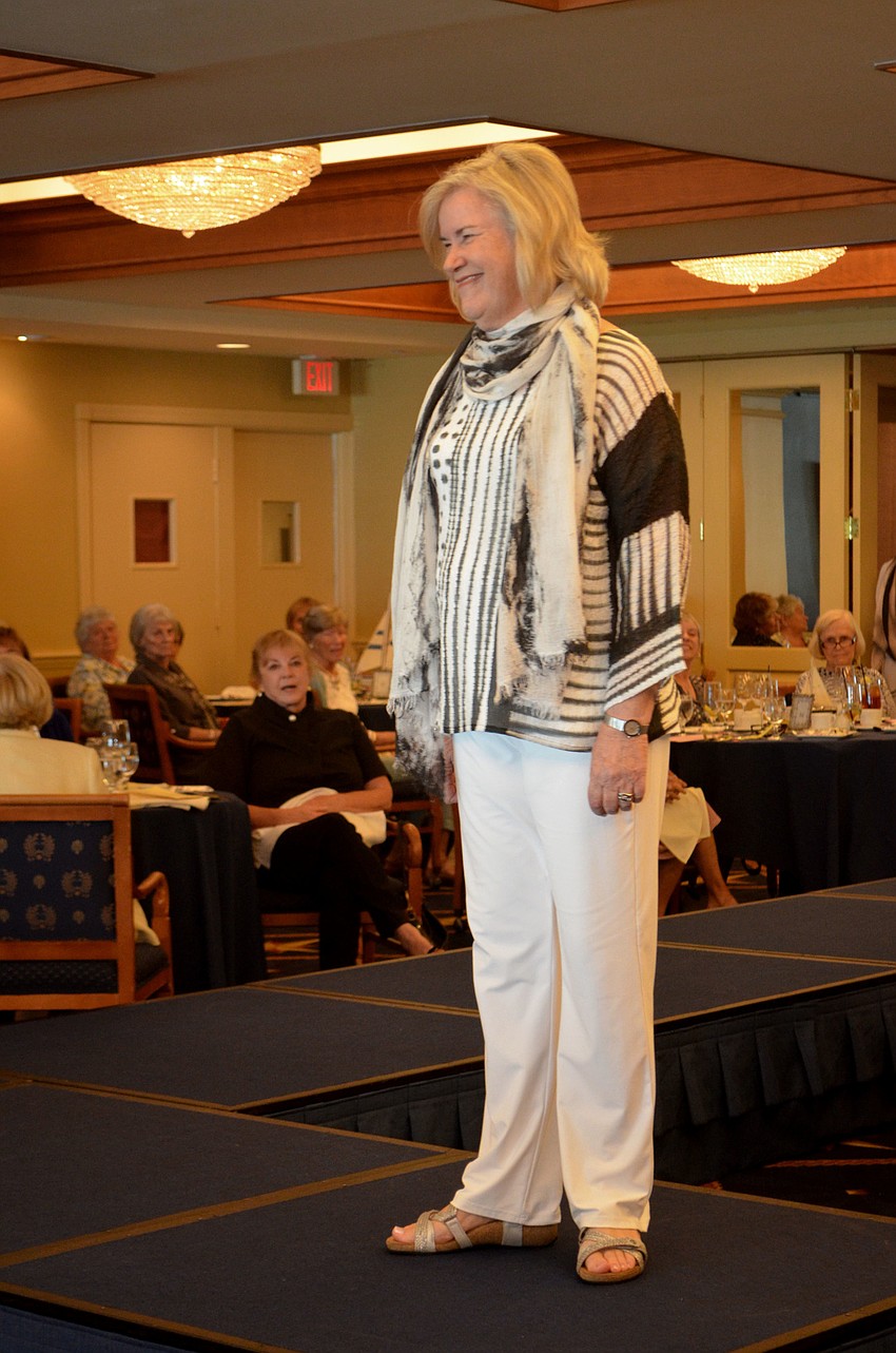 Pam Toft smiles at the crowd during the All Angels by the Sea fashion show.