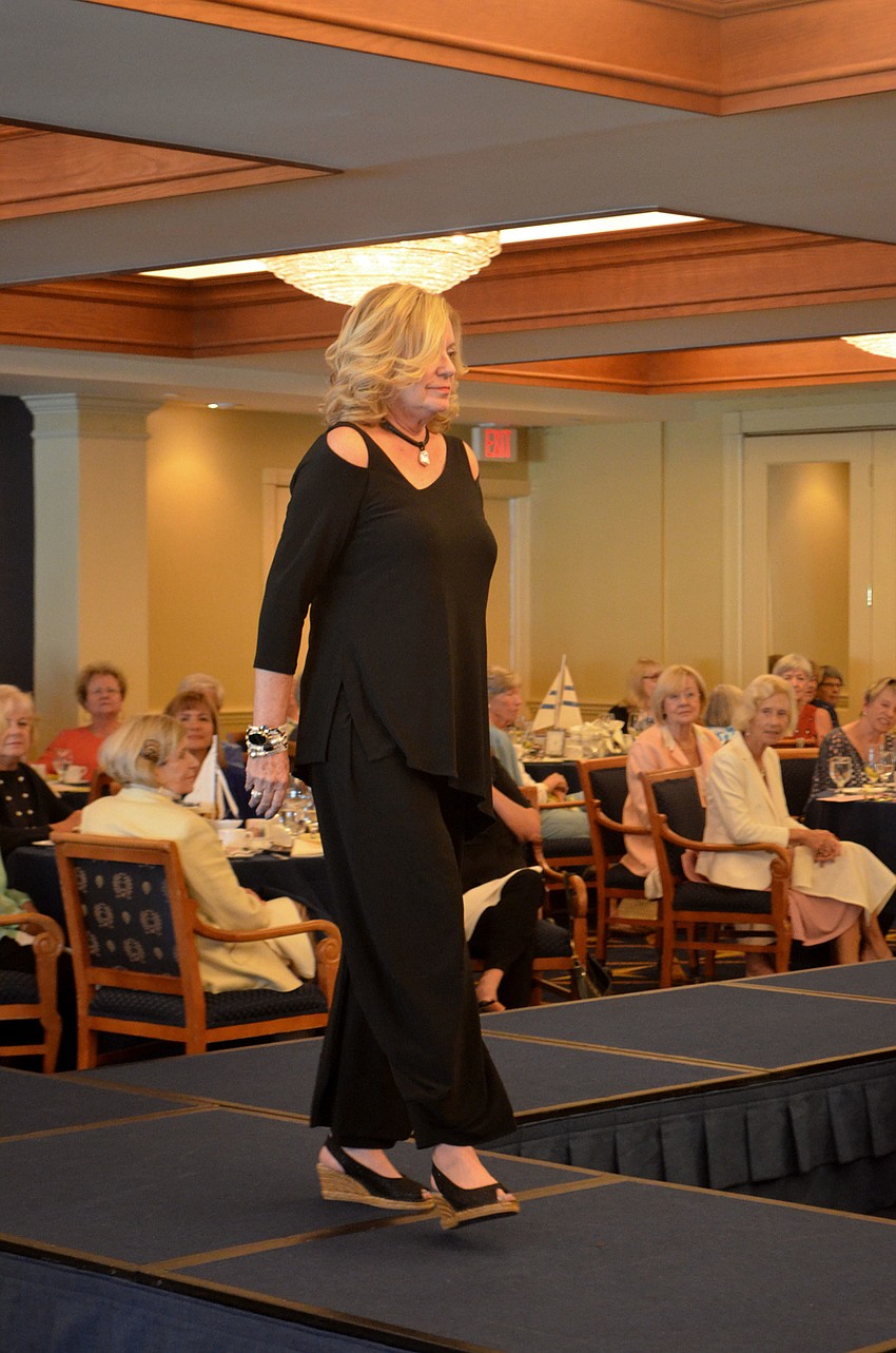 Laurel Phillips takes a turn on the runway during the All Angels by the Sea fashion show on March 8.
