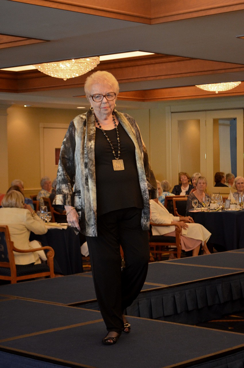 Jane Webb walks the runway during the All Angels by the Sea fashion show on March 8.