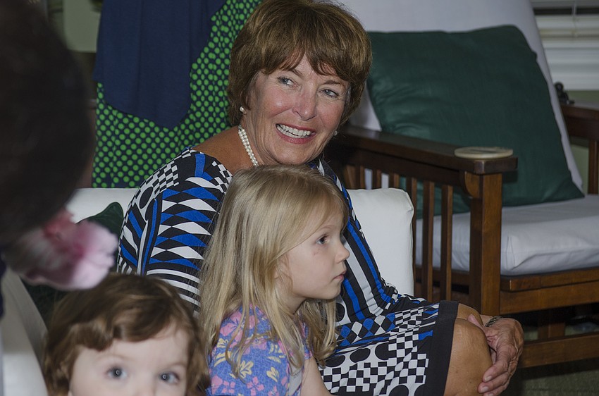 Library Foundation for Sarasota County Executive Director Suzanne Seiter sits with Abigail Gaunt and Ezra Wieland. The pair participated in the young readers advertising campaign during the fundraiser.