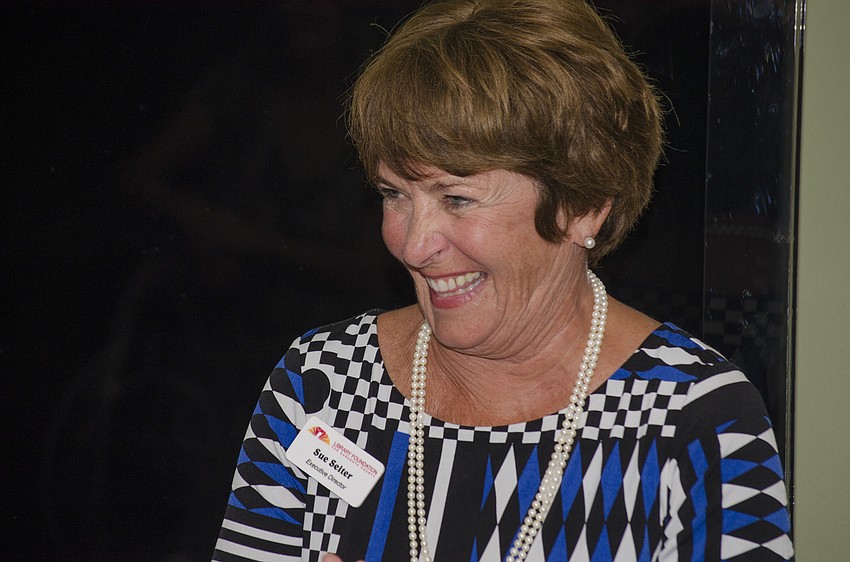 Library Foundation for Sarasota County Executive Director Suzanne Seiter smiles while thanking members of the Library Foundation for their for their efforts in raising $500,000 for the Children'         s Literacy Endowment.