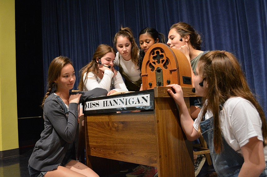 Girls at the orphanage listen to Annie go on the radio in a plea to find Annie'   s parents.