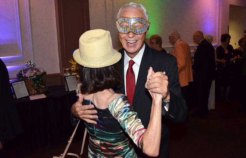 Jim Lawless and Bonnie Chappelear decide to dance in the middle of cocktail hour at the annual Artist Series Concerts of Sarasota Gala on March 8 at Michael’s On East.