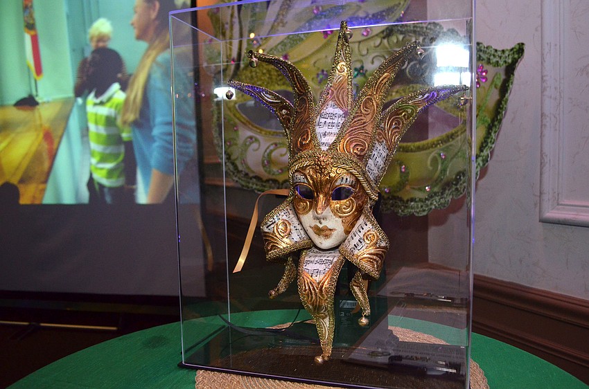 A handcrafted carnival mask valued at $400 was commissioned by Artist Series Concerts of Sarasota Managing Director John Fischer from Tragicomica Studios in Venice and up for bidding during the auction at the gala on March 8 at Mi