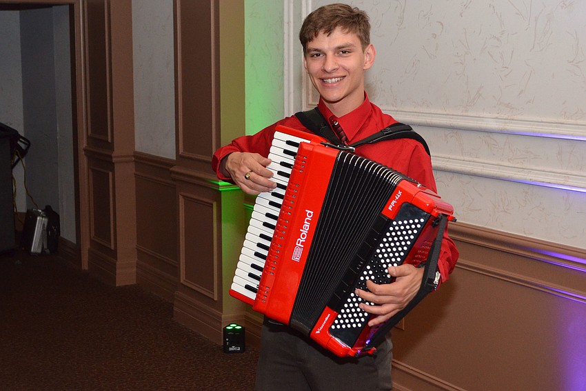 Vince Demor plays the accordion as a “strolling artist” during cocktail hour at the annual Artist Series Concerts of Sarasota Gala on March 8 at Michael’s On East.