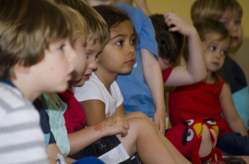 Students listen as Michelle Marano reads 