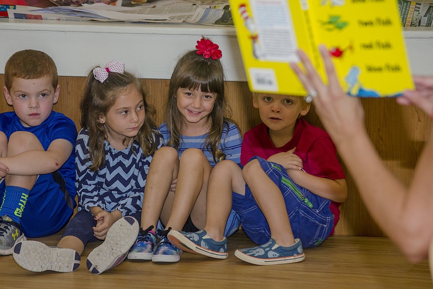 Students listen as Michelle Marano reads 