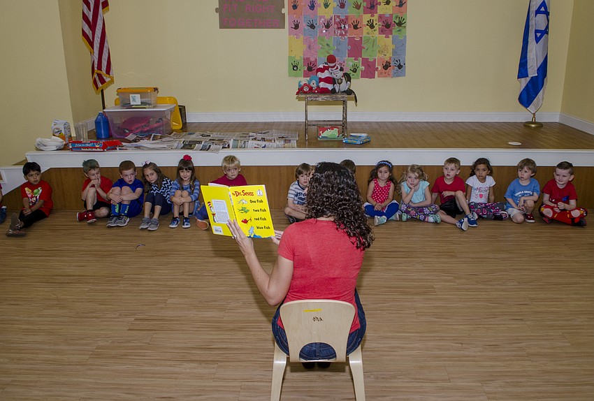 Students listen as Michelle Marano reads 