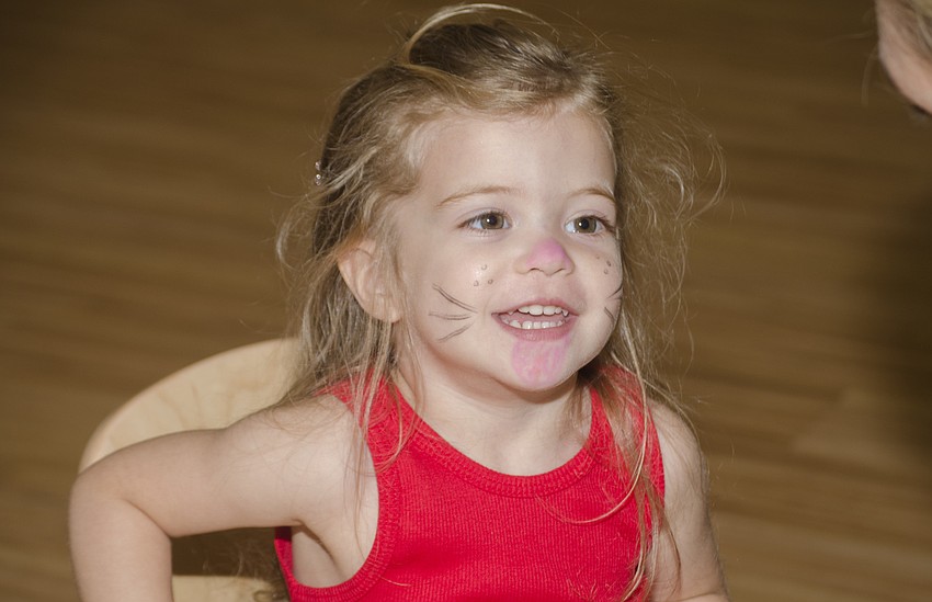 Emma Kayser smiles after getting her face painted.