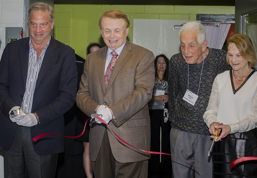 Chairman Dean Eisner, Ringling College of Art and Design President Larry Thompson, and Richard and Barbara Basch cut the ribbon on the Basch Visual Arts Center.