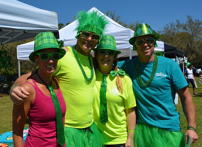 Shawna Cruikshank, Chad Lowe, Nikki Lowe and Jim Cruikshank wear their green with pride. The Cruikshanks are from Palm Aire while the Lowes live in Heritage Harbour.