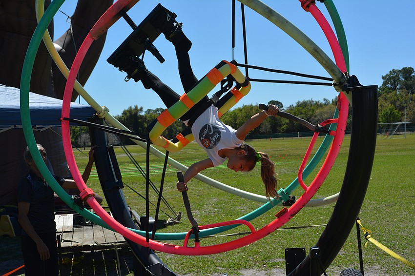 Lakewood Ranch'  s Juliana Fuschetto, 7, spins on a ride during the Irish Celtic Festival.