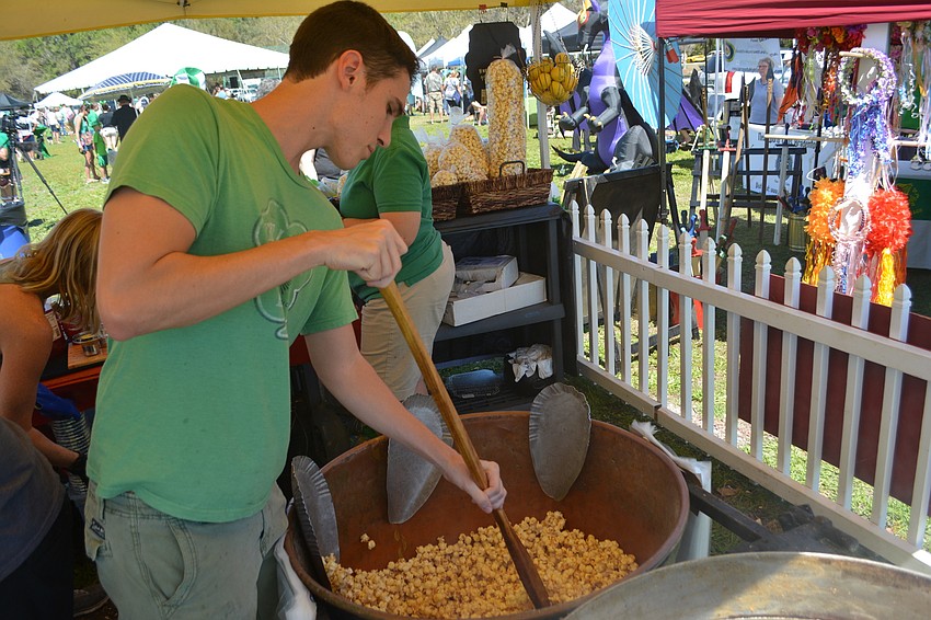 Reed Bryan of Sweet Popper Kettle Corn, stirs the pot.