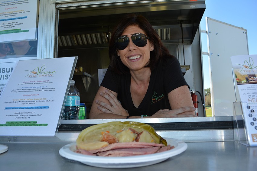 Above the Grain owner Jennifer Burns serves up corned beef and cabbage.