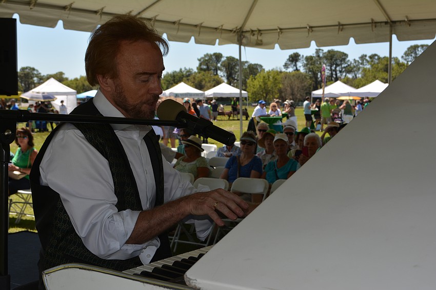 Cahal Dunne tickles the piano keys during the Irish Celtic Festival.