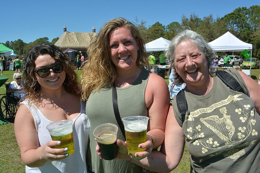 What'  s an Irish festival without beer? Chelsea Miller of Long Island, N.Y., and Lisa Boystak and Patti Boystak of Sarasota partake.