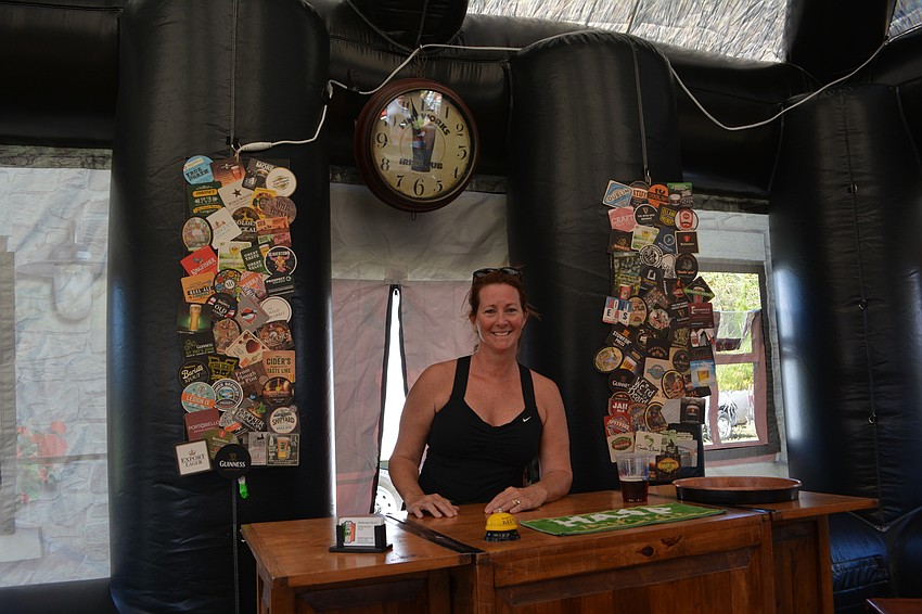 Kelly Christie, the owner of Wandering Pub  LLC, is ready for business in her inflatable pub at the Irish Celtic Festival.