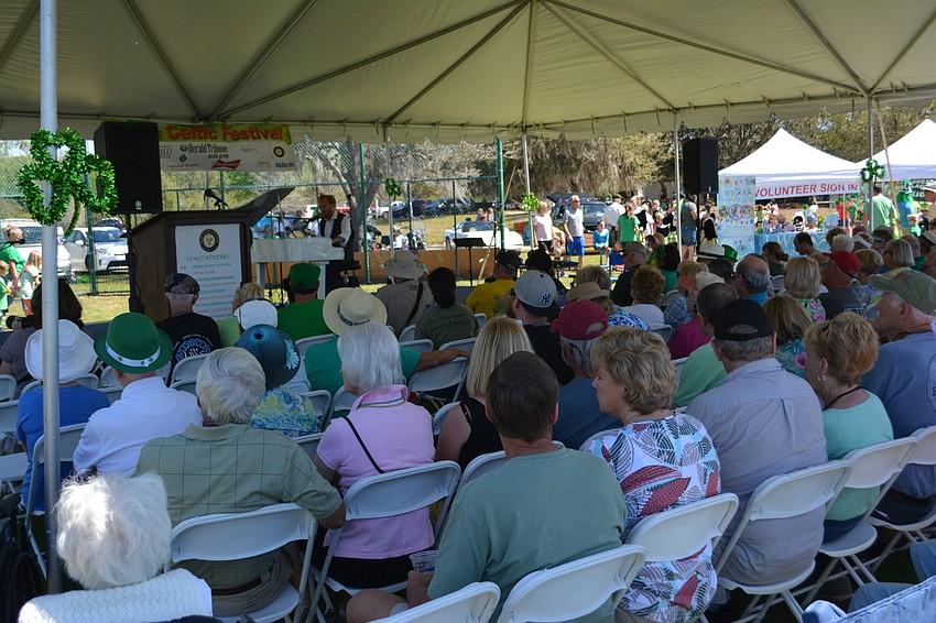 Festival goers jam under the tent to watch entertainer Cahal Dunne.