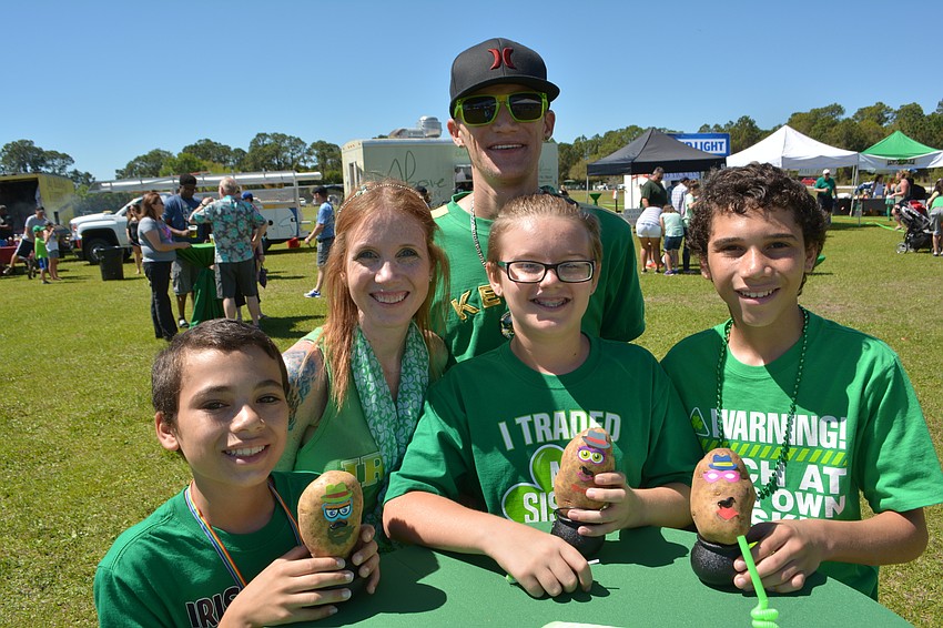 Brittany and Peter Ringleuer of Sarasota made sure their boys, Sebastian, 10, Adam, 12, and Andy, 13, played a potato game at the Irish Celtic Festival.