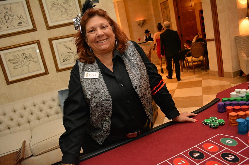 Catherine Daidone mans the roulette table.