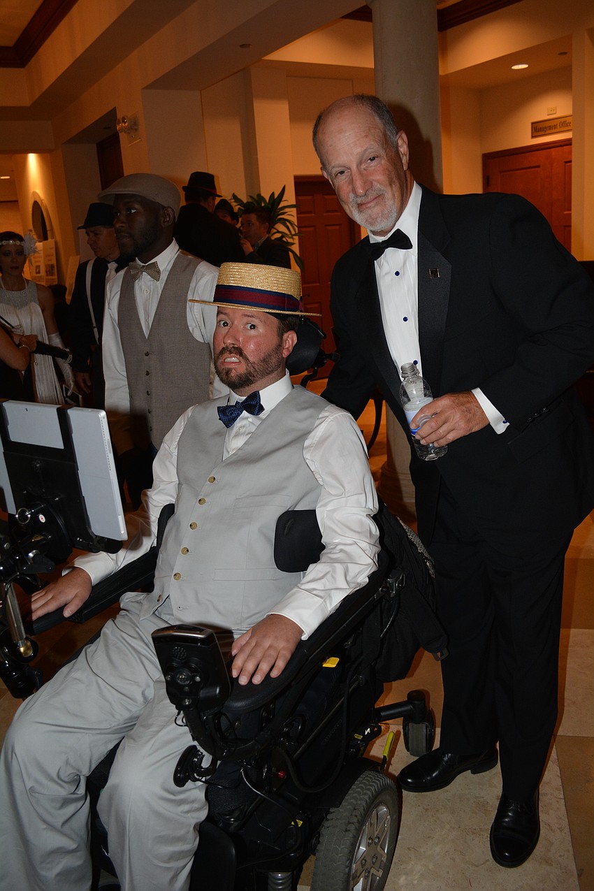 A Life Story Foundation Founder and CEO Kevin Swan with auctioneer Daniel Shaffer