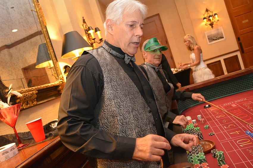 Mick Brown holds down the craps table.