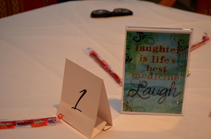 Candy and signs reading “Laughter is life’s best medicine” were on each table.