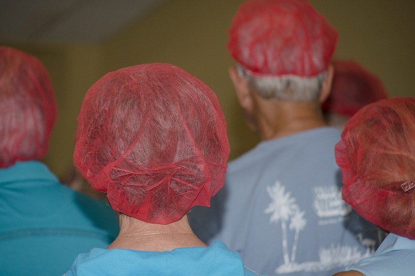 All volunteers wore read hairnets during the service.