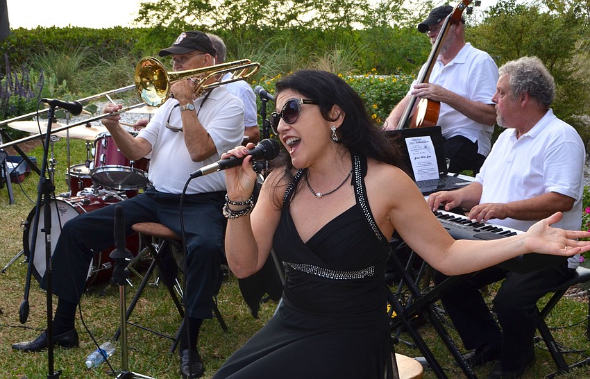 Nancy Pastore sings with the band Skip’s Dixie Mix at Friendship Around the World on March 12 at Michael’s on the Bay.