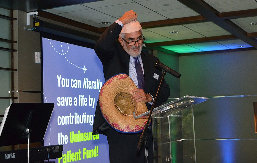 Emcee Skip Cohen shows off his “udder” hat while welcoming guests to Friendship Around the World on March 12 at Michael’s on the Bay.