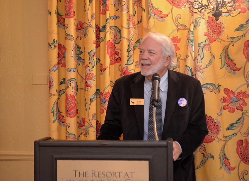 Ken Marsh, new club president, addresses club members at their March meeting at Portofino Restaurant.