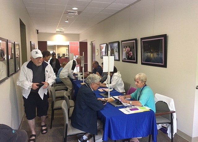 Voters sign in at Town Hall on election day.