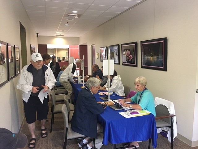 Voters sign in at Town Hall on election day.