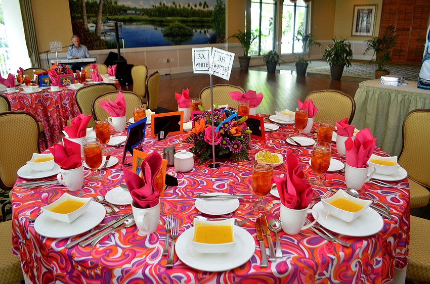 The table clothes matched the groovy theme while pictures of member and their guests circled each table.